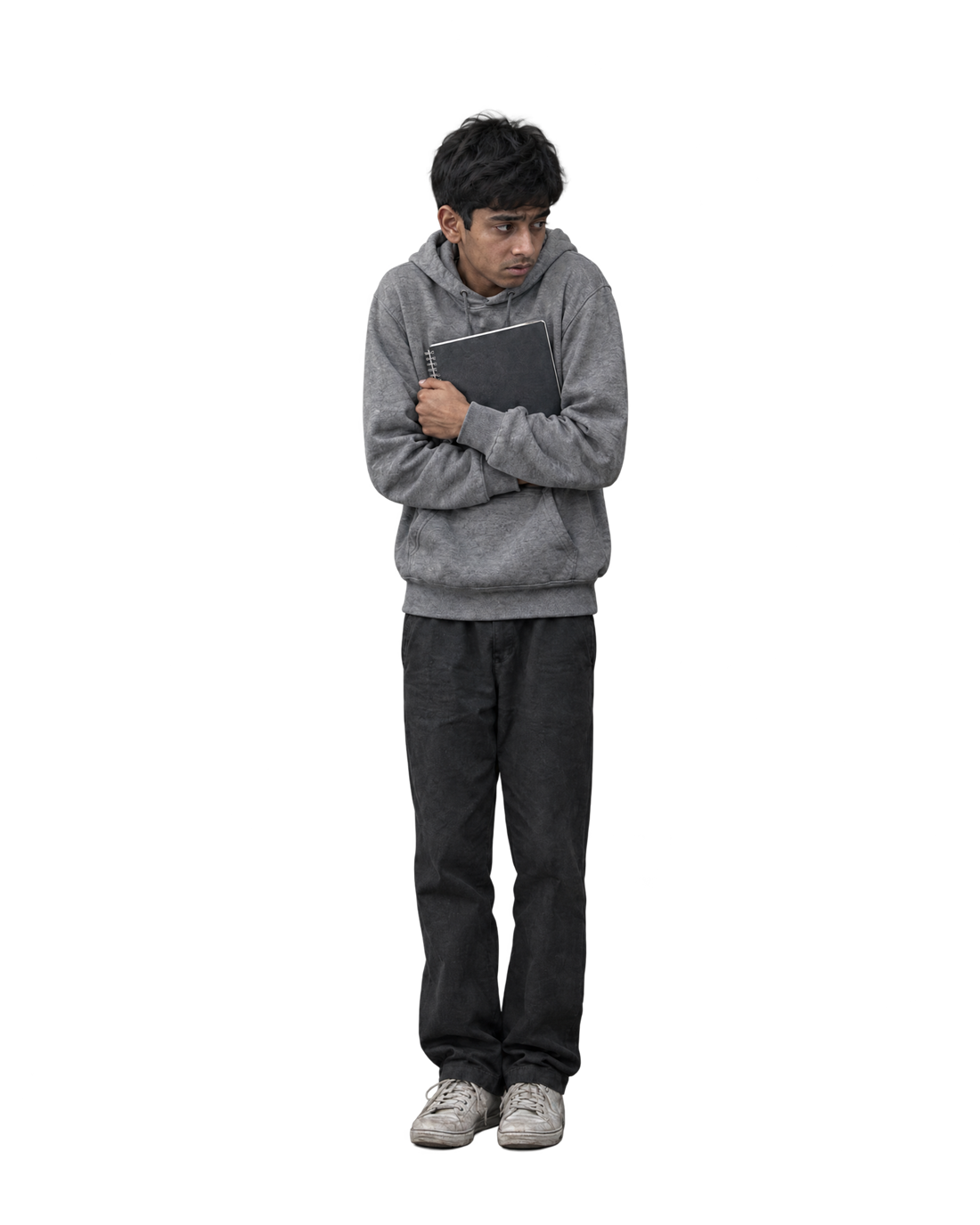 A teenage boy hugging his notebook, head down, looking anxious and unsure